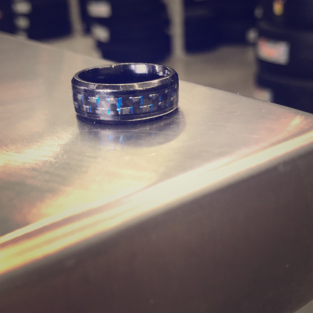 Black ring with blue highlight.